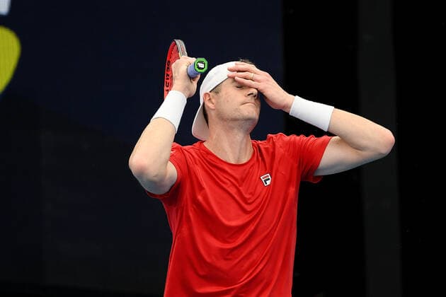SYDNEY, AUSTRALIA - JANUARY 04: John Isner of USA holds his head during the ATP, Tennis Herren Cup Tennis match between Jan-Lennard Struff of Germany and John Isner of USA at Ken Rosewall Arena on January 04, 2022 in Sydney, Australia. (Photo by Steven Markham Icon Sportswire) TENNIS: JAN 04 ATP Cup Sydney Icon2201040051