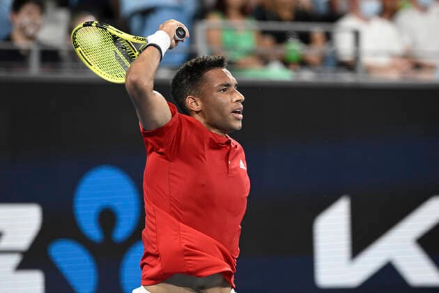 4th January 2022: Ken Rosewall Arena, Sydney Olympic Park, Sydney, Australia; ATP, Tennis Herren Cup tennis tournament, Day 4 Canada versus Great Britain; Felix Auger-Aliassime of Team Canada follows through on his shot in his tie against Cameron Norrie of Team Great Britain  ActionPlus12353220 NigelxOwen