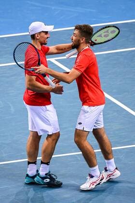 Mandatory Credit: Photo by James Gourley Shutterstock (12683878az) Jan Zielinski and Szymon Walków of Team Team Poland celebrates victory after winning their doubles ATP, Tennis Herren Cup Group Match against Team Argentina ATP Cup, Tennis, Qudos Bank Arena, Sydney, Australia - 05 Jan 2022 ATP Cup, Tennis, Qudos Bank Arena, Sydney, Australia - 05 Jan 2022  Copyright: xJamesxGourley Shutterstockx 12683878az