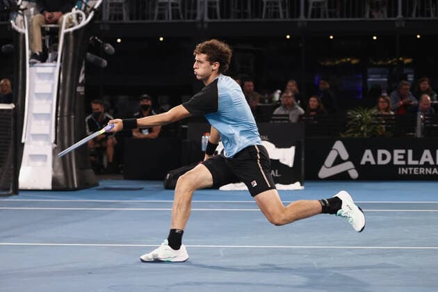 ADELAIDE, AUSTRALIA - JANUARY 06: Juan Manuel Cerundolo of Argentina volleys the ball during the ATP, Tennis Herren singles match between Gael Monfils of France and Juan Manuel Cerundolo of Argentina on day four of the Adelaide International tennis tournament at Memorial Drive on January 06, 2022 in Adelaide, Australia. (Photo by Peter Mundy Speed Media Icon Sportswire) TENNIS: JAN 06 Adelaide International Icon220106222