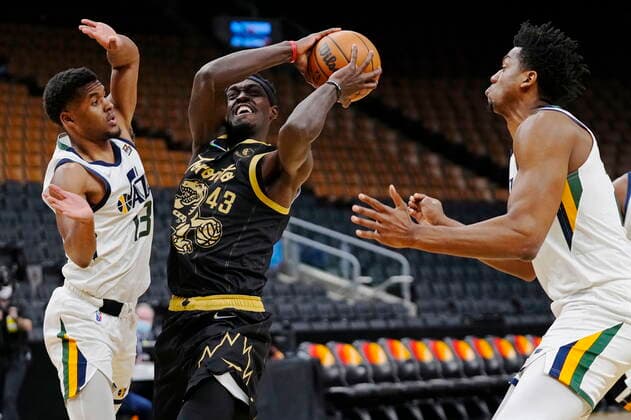 January 7, 2022, Toronto, ON, Canada: Toronto Raptors forward Pascal Siakam (43) protects the ball from Utah Jazz guard Jared Butler (13) and centre Hassan Whiteside, right, during first half NBA, Basketball Herren, USA basketball action in Toronto on Friday, January 7, 2022. Canada News - January 7, 2022 - ZUMAc35_ 20220107_zaf_c35_088 Copyright: xFrankxGunnx