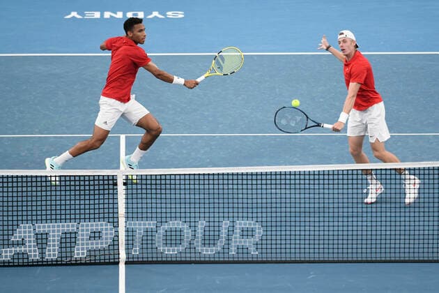 8th January 2022: Ken Rosewall Arena, Sydney Olympic Park, Sydney, Australia; ATP, Tennis Herren Cup tennis tournament, Semi Final Canada versus Russia; Denis Shapovalov of Team Canada hits a volley in their doubles match against Daniil Medvedev and Roman Safiullin of Team Russia  ActionPlus12354324 NigelxOwen