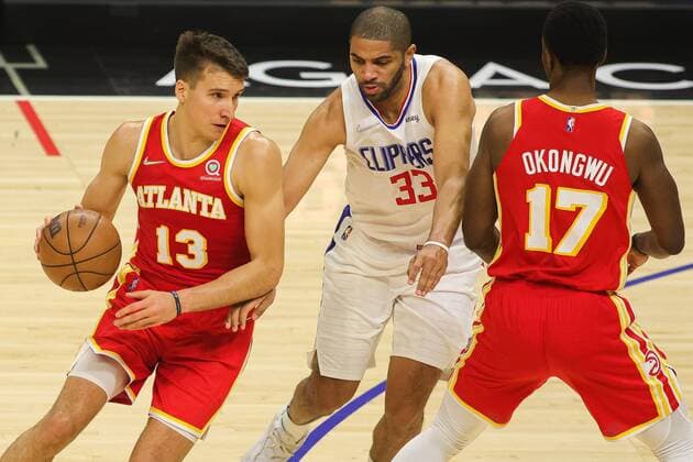 Bogdan Bogdanovic 13 of the Atlanta Hawks dribbles around Nicolas Batum 33 of the LA Clippers, during a basketball match between Los Angeles Clippers and Atlanta Hawks, at Crypto.com Arena in Los Angeles, US, 9 January 2022. Los Angeles Clippers vs Atlanta Hawks !ACHTUNG: NUR REDAKTIONELLE NUTZUNG!  Copyright: xPHILLIPxKIMx AME8094 20220109-b3100677558d06848382bb3423ed1ec71b73c9a0