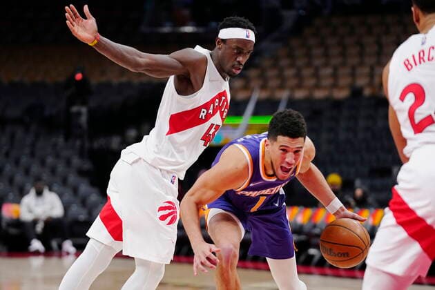 January 11, 2022, Toronto, ON, CANADA: Phoenix Suns guard Devin Booker (1) drives past Toronto Raptors forward Pascal Siakam (43) during first half NBA, Basketball Herren, USA basketball action in Toronto on Tuesday, January 11, 2022. Canada News - January 11, 2022  - ZUMAc35_ 20220111_zaf_c35_051 Copyright: xFrankxGunnx