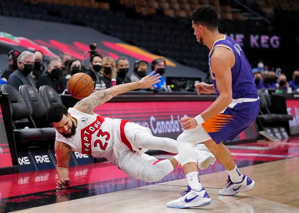 January 11, 2022, Toronto, Canada: Phoenix Suns guard DEVIN BOOKER (1) knocks over Toronto Raptors guard FRED VANVLEET (23) during second half NBA, Basketball Herren, USA basketball action. NBA 2022: Suns 99:95 Raptors  - ZUMAc35_ 20220111_zaf_c35_057 Copyright: xFrankxGunnx