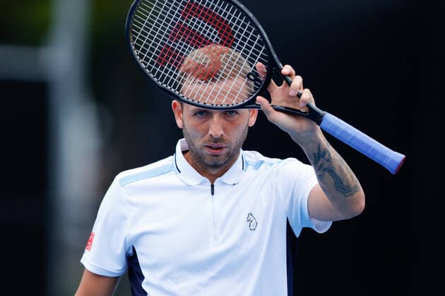 Dan Evans of Great Britain raises his racquet after defeating Pedro Martinez of Spain during the Round of 16 match at the Sydney Tennis Classic 2022 at Sydney Olympic Park Tennis Centre, Sydney, Australia on 12 January 2022. Copyright: xPeterxDovganx 30470287