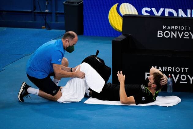 Mandatory Credit: Photo by Shutterstock (12757785v) David Goffin receiving medical treatment during his Quarter Final Match Sydney Tennis Classic, Day 5, Tennis, Olympic Park, Sydney, Australia - 13 Jan 2022 Sydney Tennis Classic, Day 5, Tennis, Olympic Park, Sydney, Australia - 13 Jan 2022  Copyright: xShutterstockx 12757785v