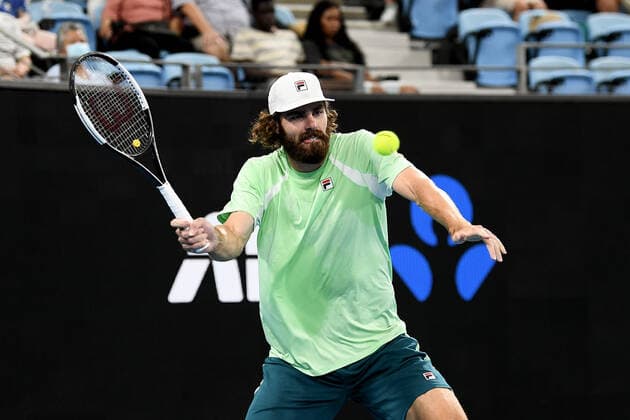 SYDNEY, AUSTRALIA - JANUARY 14: Reilly Opelka of USA plays a forehand during the Sydney Classic Tennis match between Andy Murray of Great Britain and Reilly Opelka of USA at Ken Rosewall Arena on January 14, 2022 in Sydney, Australia. (Photo by Steven Markham Icon Sportswire) TENNIS: JAN 14 Sydney Classic Icon2201140073