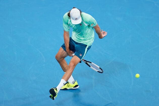 Reilly Opelka of USA plays a shot between his legs against Andy Murray of Great Britain during the MenÕs Semi Final at the Sydney Tennis Classic 2022 at Sydney Olympic Park Tennis Centre, Sydney, Australia on 14 January 2022. Copyright: xPeterxDovganx 30470649