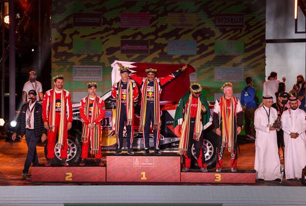 201 Al-Attiyah Nasser (qat), Baumel Batthieu (fra), Toyota Gazoo Racing, Toyota GR DKR Hilux T1+, Auto FIA T1 T2, W2RC, portrait, podium with 211 Loeb Sebastien (fra), Lurquin Fabian (bel), Bahrain Raid Xtreme, BRX Prodrive Hunter T1+, Auto FIA T1 T2, W2RC and 205 Al Rajhi Yazeed (sau), Orr Michael (gbr), Overdrive Toyota, Toyota Hilux Overdrive, Auto FIA T1 T2, W2RC during the Podium Finish of the Dakar Rally 2022, on January 14th 2022 in Jeddah, Saudi Arabia - AUTO - DAKAR 2022 - PODIUM FINISH DPPI Panoramic  JDR55427