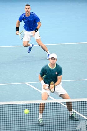15th January 2022: Ken Rosewall Arena, Sydney Olympic Park, Sydney, Australia; Sydney Tennis Classic, Day 7 Mens Doubles Final: Filip Polasek of Slovakia serves as partner John Peers of Australia waits at the net in their match against Simone Bolelli and Fabio Fognini of Italy  ActionPlus12356184 NigelxOwen