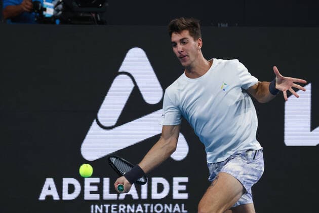 ADELAIDE, AUSTRALIA - JANUARY 15: Thanasi Kokkinakis of Australia plays a forehand during the ATP, Tennis Herren final singles match between Arthur Rinderknech of France and Thanasi Kokkinakis of Australia on day seven of the Adelaide International tennis tournament 2 at Memorial Drive on January 15, 2022 in Adelaide, Australia. (Photo by Peter Mundy Speed Media Icon Sportswire) TENNIS: JAN 15 Adelaide International Icon2201150148