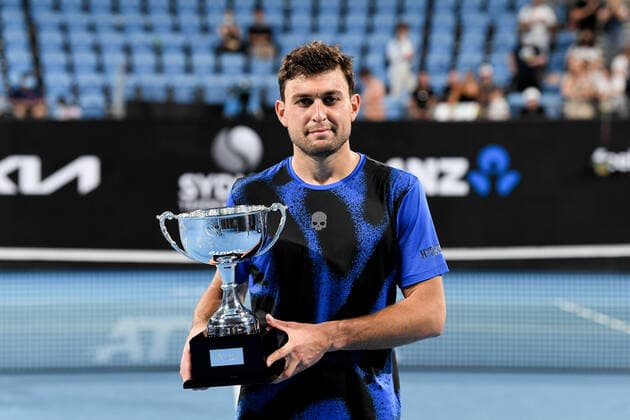 SYDNEY, AUSTRALIA - JANUARY 15: Aslan Karatsev of Russia holds up the winners trophy after the Sydney Classic Tennis men s singles final between Andy Murray of Great Britain and Aslan Karatsev of Russia at Ken Rosewall Arena on January 15, 2022 in Sydney, Australia. (Photo by Steven Markham Icon Sportswire) TENNIS: JAN 15 Sydney Classic Icon2201150200