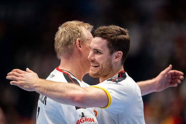 220116 Patrick Wiencek and Johannes Golla of Germany celebrate after the 2022 EHF European Handball Championship match between Germany and Austria on January 16, 2022 in Bratislava Photo Petter Arvidson BILDBYRAN kod PA PA0370 bbeng ehf euro 2022 em 2022 european men handball s handball championship 2022 handball handboll handball em 2022 handball handball em 2022 germany austria germany austria Cheers,  Copyright: PETTERxARVIDSON BB220116PA072
