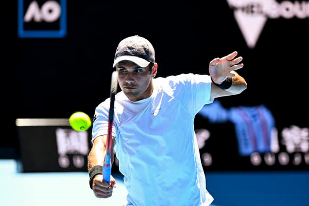 TENNIS AUSTRALIAN OPEN, Marcos Giron of the United States plays a shot during his first Round Men s singles match against Rafael Nadal of Spain on Day 1 of the Australian Open, at Melbourne Park, in Melbourne, Monday, January 17, 2022. ( NO ARCHIVING, EDITORIAL USE ONLY, NO USE IN BOOKS WITHOUT CONSENT MELBOURNE VIC AUSTRALIA  Copyright: xDAVExHUNTx 20220117001614134916