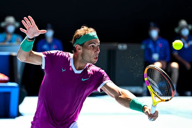 TENNIS AUSTRALIAN OPEN, Rafael Nadal of Spain plays a shot during his first Round Men s singles match against Marcos Giron of the United States on Day 1 of the Australian Open, at Melbourne Park, in Melbourne, Monday, January 17, 2022. ( NO ARCHIVING, EDITORIAL USE ONLY, NO USE IN BOOKS WITHOUT CONSENT MELBOURNE VIC AUSTRALIA  Copyright: xDAVExHUNTx 20220117001614135898