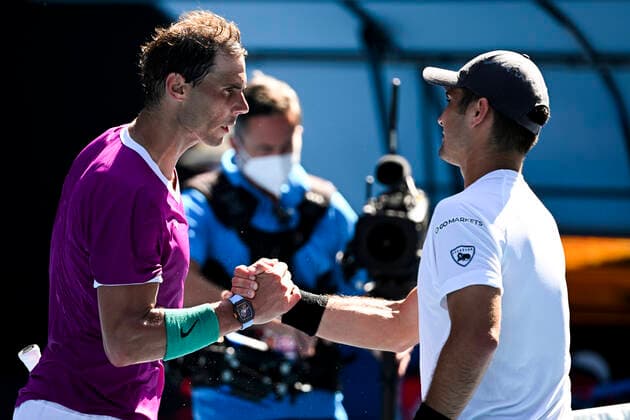 TENNIS AUSTRALIAN OPEN, Rafael Nadal of Spain (left) and Marcos Giron of the United States shake hands after their first Round Men s singles match on Day 1 of the Australian Open, at Melbourne Park, in Melbourne, Monday, January 17, 2022. ( NO ARCHIVING, EDITORIAL USE ONLY, NO USE IN BOOKS WITHOUT CONSENT MELBOURNE VIC AUSTRALIA  Copyright: xDAVExHUNTx 20220117001614147510
