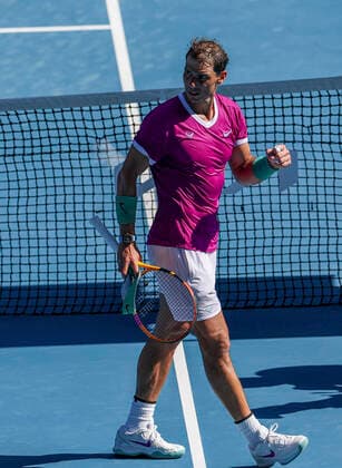(220117) -- MELBOURNE, Jan. 17, 2022 -- Rafal Nadal of Spain celebrates after the men s singles first round match against Marcos Giron of the United States at Australian Open 2022 in Melbourne, Australia on Jan. 17, 2022. ) (SP)AUSTRALIA-MELBOURNE-TENNIS-AUSTRALIAN OPEN-MEN S SINGLES BaixXuefei 