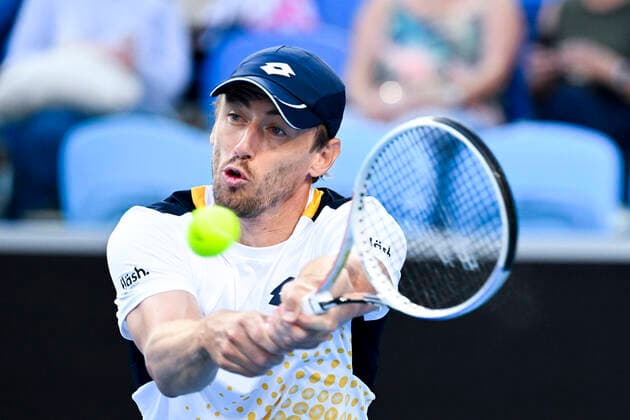 TENNIS AUSTRALIAN OPEN, John Millman of Australia plays a shot during his first Round Men s singles match against Feliciano Lopez of Spain on Day 1 of the Australian Open, at Melbourne Park, in Melbourne, Monday, January 17, 2022. ( NO ARCHIVING, EDITORIAL USE ONLY, NO USE IN BOOKS WITHOUT CONSENT MELBOURNE VIC AUSTRALIA  Copyright: xDEANxLEWINSx 20220117001614160074