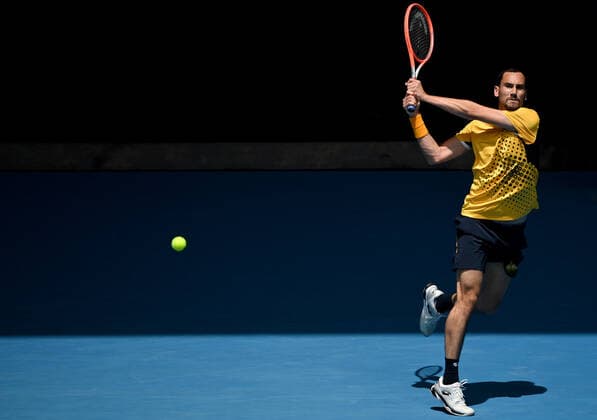 TENNIS AUSTRALIAN OPEN, Gianluca Mager of Italy plays a shot during the first round Men?s singles match against Andrey Rublev of Russia on Day 2 of the Australian Open, at Melbourne Park, in Melbourne, Tuesday, January 18, 2022. ( NO ARCHIVING, EDITORIAL USE ONLY, NO USE IN BOOKS WITHOUT CONSENT MELBOURNE VIC AUSTRALIA  Copyright: xJOELxCARRETTx 20220118001614362525