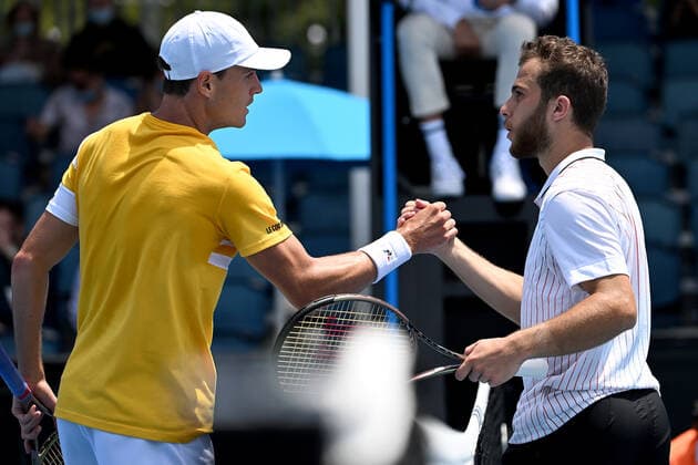 TENNIS AUSTRALIAN OPEN, Christopher O?Connell of Australia (left) shakes hands with Hugo Gaston of France after winning the first round Men?s singles match on Day 2 of the Australian Open, at Melbourne Park, in Melbourne, Tuesday, January 18, 2022. ( NO ARCHIVING, EDITORIAL USE ONLY, NO USE IN BOOKS WITHOUT CONSENT MELBOURNE VIC AUSTRALIA  Copyright: xDAVExHUNTx 20220118001614366942