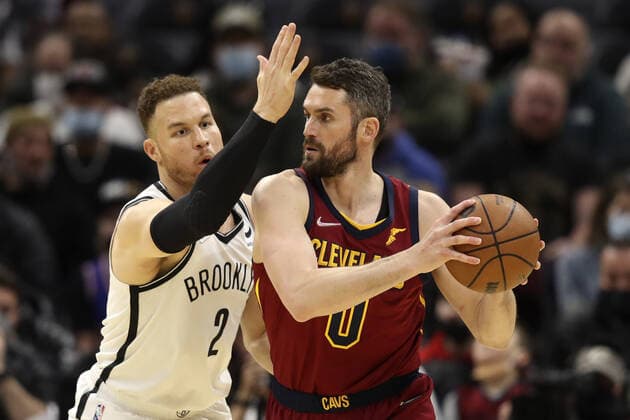 Cleveland Cavaliers Kevin Love (0) looks to make a move on Brooklyn Nets Blake Griffin (2) at Rocket Mortgage Field House in Cleveland, Ohio on Monday, January 17, 2022.  CLE20220117105 AARONxJOSEFCZYK