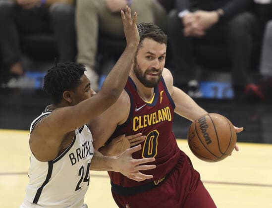 Cleveland Cavaliers Kevin Love (0) goes to the basket defended by Brooklyn Nets Jordan Bowden (24) at Rocket Mortgage Field House in Cleveland, Ohio on Monday, January 17, 2022.  CLE20220117119 AARONxJOSEFCZYK