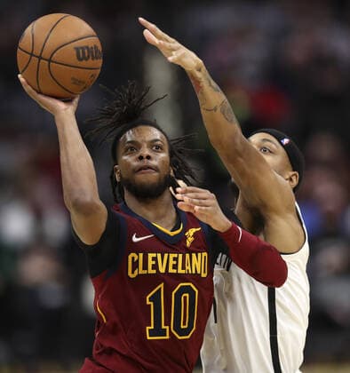 Cleveland Cavaliers Darius Garland (10) puts up a shot past Brooklyn Nets Bruce Brown (1) at Rocket Mortgage Field House in Cleveland, Ohio on Monday, January 17, 2022.  CLE20220117104 AARONxJOSEFCZYK