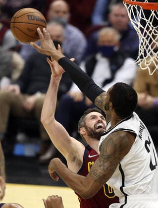 Cleveland Cavaliers Kevin Love (0) has his shot blocked by Brooklyn Nets LaMarcus Aldridge (21) at Rocket Mortgage Field House in Cleveland, Ohio on Monday, January 17, 2022.  CLE20220117117 AARONxJOSEFCZYK