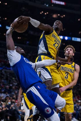 January 17, 2022, Los Angeles, California, USA: Caris LeVert 22 of the Indiana Pacers blocks a shot from Reggie Jackson 1 of the Los Angeles Clippers during their NBA, Basketball Herren, USA game on Monday January 17, 2022 at Crypto.com Arena in Los Angeles, California. Clippers defeat Pacers, 139-133. ARIANA RUIZ PI Los Angeles USA - ZUMAp124 20220117_zaa_p124_011 Copyright: xArianaxRuizx