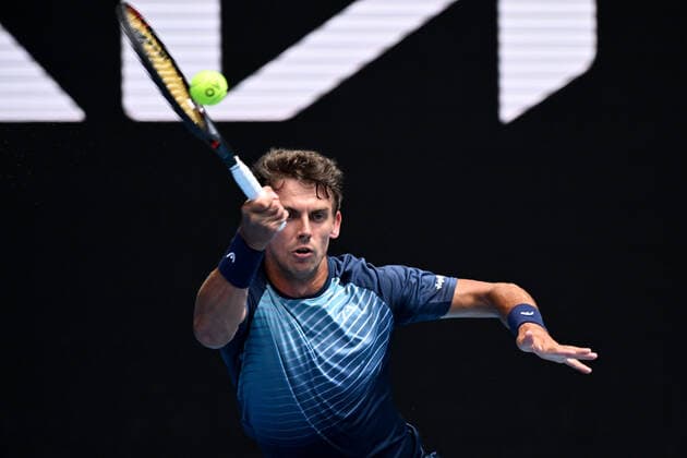 TENNIS AUSTRALIAN OPEN, Henri Laaksonen of Switzerland returns during his first round Men?s singles match against Daniil Medvedev of Russia on Day 2 of the Australian Open, at Melbourne Park, in Melbourne, Tuesday, January 18, 2022. ( NO ARCHIVING, EDITORIAL USE ONLY, NO USE IN BOOKS WITHOUT CONSENT MELBOURNE VIC AUSTRALIA  Copyright: xDEANxLEWINSx 20220118001614373145