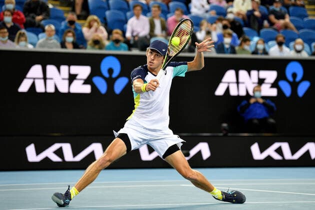 TENNIS AUSTRALIAN OPEN, Alex de Minaur of Australia plays a shot during his first round singles match against Lorenzo Musetti of Italy on Day 2 of the Australian Open, at Melbourne Park, in Melbourne, Tuesday, January 18, 2022. ( NO ARCHIVING, EDITORIAL USE ONLY, NO USE IN BOOKS WITHOUT CONSENT MELBOURNE VIC AUSTRALIA  Copyright: xJAMESxROSSx 20220118001614412735