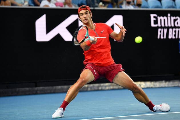TENNIS AUSTRALIAN OPEN, Lorenzo Musetti of Italy plays a shot during his first round singles match against Alex de Minaur of Australia on Day 2 of the Australian Open, at Melbourne Park, in Melbourne, Tuesday, January 18, 2022. ( NO ARCHIVING, EDITORIAL USE ONLY, NO USE IN BOOKS WITHOUT CONSENT MELBOURNE VIC AUSTRALIA  Copyright: xJAMESxROSSx 20220118001614412821