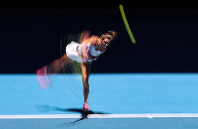 (220119) -- MELBOURNE, Jan. 19, 2022 -- Lucia Bronzetti of Italy serves during the Women s Singles second round match against Ashleigh Barty of Australia at Australian Open in Melbourne Park, in Melbourne, Australia, on Jan. 19, 2022. ) (SP)AUSTRALIA-MELBOURNE-TENNIS-AUSTRALIAN OPEN-WOMEN S SINGLES BaixXuefei 