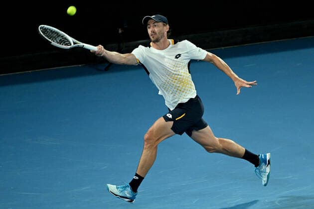 TENNIS AUSTRALIAN OPEN, John Millman of Australia plays a shot during his second round Men?s singles match against Alexander Zverev of Germany on Day 3 of the Australian Open, at Melbourne Park, in Melbourne, Wednesday, January 19, 2022. ( NO ARCHIVING, EDITORIAL USE ONLY, NO USE IN BOOKS WITHOUT CONSENT MELBOURNE VIC AUSTRALIA  Copyright: xDAVExHUNTx 20220119001614701091