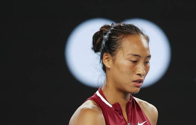 (220119) -- MELBOURNE, Jan. 19, 2022 -- Zheng Qinwen of China reacts during the Women s Single second round match against Maria Sakkari of Greece at Australian Open 2022 in Melbourne, Australia, on Jan. 19, 2022. ) (SP)AUSTRALIA-MELBOURNE-TENNIS-AUSTRALIAN OPEN-WOMEN S SINGLES BaixXuefei 