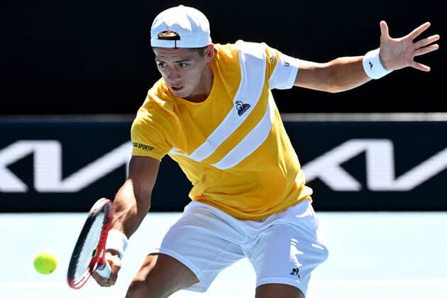 TENNIS AUSTRALIAN OPEN, Sebastian Baez of Argentina plays a shot during his second round Men?s singles match against Stefanos Tsitsipas of Greece on day 4 of the Australian Open at Melbourne Park in Melbourne, Thursday, January 20, 2022. ( NO ARCHIVING, EDITORIAL USE ONLY, NO USE IN BOOKS WITHOUT CONSENT MELBOURNE VICTORIA AUSTRALIA  Copyright: xJOELxCARRETTx 20220120001615101991