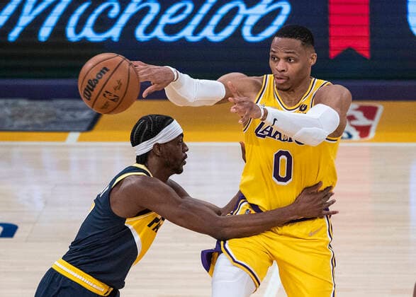 January 19, 2022, Los Angeles, California, USA: Russell Westbrook 0 of the Los Angeles Lakers defended by Justin Holiday 8 of the Indiana Pacers during their NBA, Basketball Herren, USA game on Wednesday January 19, 2022 at Crypto.com Arena in Los Angeles, California. PI Los Angeles USA - ZUMAp124 20220119_zaa_p124_033 Copyright: xJAVIERxROJASx