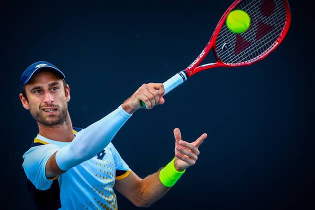 Belgian Sander Gille pictured in action during a tennis match between the Belgian pair Gille-Vliegen and the French pair Bonzi-Rinderknech, in the first round of the men s doubles at the Australian Open Grand Slam tennis tournament, Thursday 20 January 2022 in Melbourne Park, Melbourne, Australia. The 2022 edition of the Australian Grand Slam takes place from January 17th to January 30th. PATRICKxHAMILTON  x4067045x