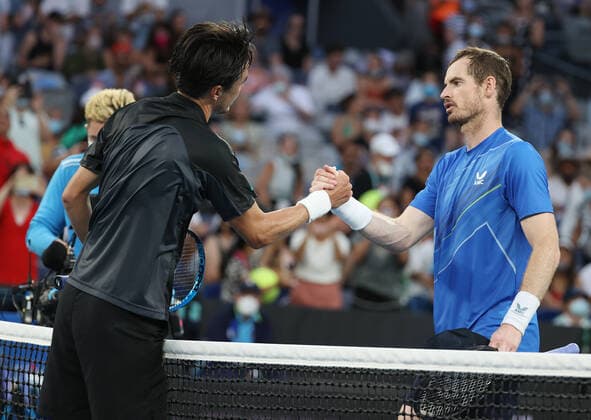 (220120) -- MELBOURNE, Jan. 20, 2022 -- Andy Murray (R) of Britain shakes hands with Daniel Taro of Japan after their men s singles second round match at Australian Open 2022 in Melbourne, Australia, on Jan. 20, 2022. ) (SP)AUSTRALIA-MELBOURNE-TENNIS-AUSTRALIAN OPEN-MEN S SINGLES BaixXuefei 