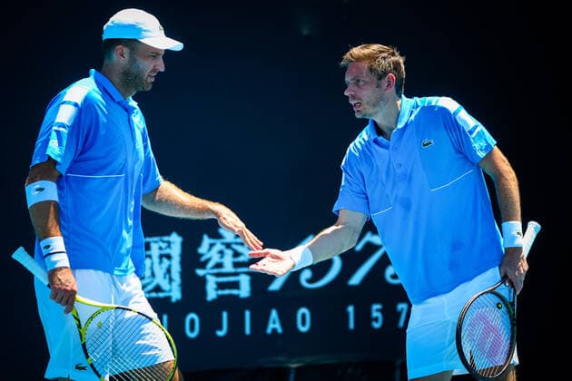 French Fabrice Martin and French Nicolas Mahut pictured during their men s doubles match, at the Australian Open Grand Slam tennis tournament, Thursday 20 January 2022 in Melbourne Park, Melbourne, Australia. The 2022 edition of the Australian Grand Slam takes place from January 17th to January 30th. PATRICKxHAMILTON  x4077006x