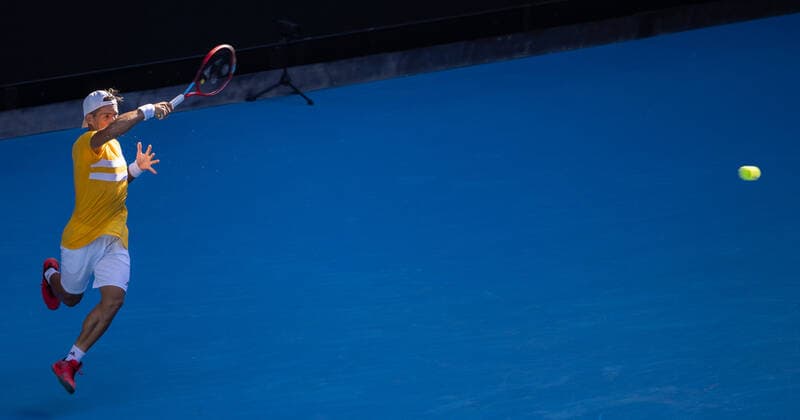 (220120) -- MELBOURNE, Jan. 20, 2022 -- Sebastian Baez of Argentina competes during the men s singles 2nd round match against Stefanos Tsitsipas of Greece at Australian Open in Melbourne Park, in Melbourne, Australia, Jan. 20, 2022. (Photo by Xinhua) (SP)AUSTRALIA-MELBOURNE-TENNIS-AUSTRALIAN OPEN-MEN S SINGLES HuxJingchen 