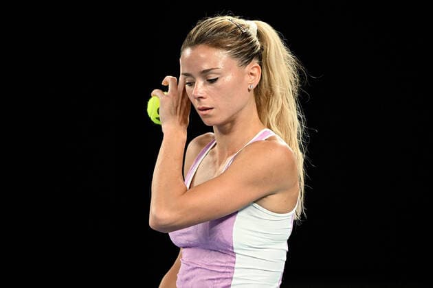TENNIS AUSTRALIAN OPEN, Camila Giorgi of Italy prepares to serve during her third round Women?s singles match against Ashleigh Barty of Australia on Day 5 of the Australian Open, at Melbourne Park, in Melbourne, Friday, January 21, 2022. ( NO ARCHIVING, EDITORIAL USE ONLY, NO USE IN BOOKS WITHOUT CONSENT MELBOURNE VIC AUSTRALIA  Copyright: xDAVExHUNTx 20220121001615440249