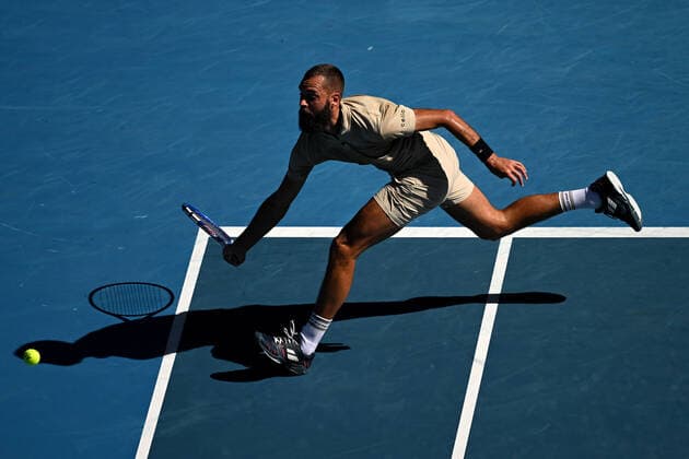 TENNIS AUSTRALIAN OPEN, Benoit Paire of France plays a shot during his third round match against Stefanos Tsitsipas of Greece on Day 6 of the Australian Open, at Melbourne Park, in Melbourne, Saturday, January 22, 2022. ( NO ARCHIVING, EDITORIAL USE ONLY, NO USE IN BOOKS WITHOUT CONSENT MELBOURNE VIC AUSTRALIA  Copyright: xDEANxLEWINSx 20220122001615792571