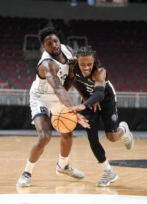 (220122) -- RIGA, Jan. 22, 2022 -- Jalen Riley (R) of VEF Riga vies with Jacques Alingue of JDA Dijon Basket during the Europe Basketball Champions League Play-ins match between VEF Riga and JDA Dijon Basket in Riga, Latvia, Jan. 21, 2022. (Photo by Xinhua) (SP)LATVIA-RIGA-BASKETBALL-EUROPE CHAMPIONS LEAGUE-VEF RIGA VS JDA DIJON EdijsxPalens 