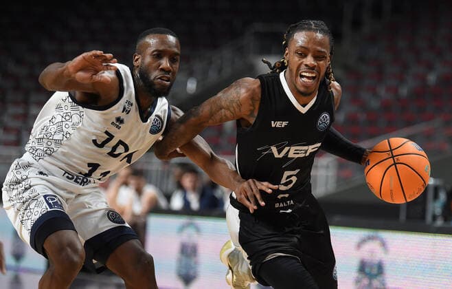(220122) -- RIGA, Jan. 22, 2022 -- Jalen Riley (R) of VEF Riga vies with David Holston of JDA Dijon Basket during the Europe Basketball Champions League Play-ins match between VEF Riga and JDA Dijon Basket in Riga, Latvia, Jan. 21, 2022. (Photo by Xinhua) (SP)LATVIA-RIGA-BASKETBALL-EUROPE CHAMPIONS LEAGUE-VEF RIGA VS JDA DIJON EdijsxPalens 