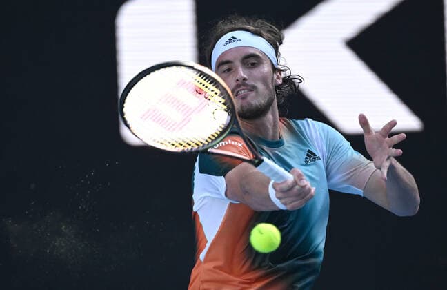 TENNIS AUSTRALIAN OPEN, Stefanos Tsitsipas of Greece plays a shot during his third round match against Benoit Paire of France on Day 6 of the Australian Open, at Melbourne Park, in Melbourne, Saturday, January 22, 2022. ( NO ARCHIVING, EDITORIAL USE ONLY, NO USE IN BOOKS WITHOUT CONSENT MELBOURNE VIC AUSTRALIA  Copyright: xDEANxLEWINSx 20220122001615813349