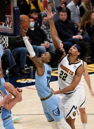 Memphis Grizzlies guard Ja Morant (L) goes in for a basket against Denver Nuggets forward Zeke Nnaji (R) during the third quarter of the NBA, Basketball Herren, USA match held between the Memphis Grizzlies at the Ball Arena in Denver, CO, USA, 21 January 2022. Memphis Grizzlies defeated the Denver Nuggets, 122-118. Memphis Grizzlies at Denver Nuggets !ACHTUNG: NUR REDAKTIONELLE NUTZUNG!  Copyright: xToddxPiersonx USA4634 20220122-084ea4c93211038db4afbc51f5e01b0eef6cbddb