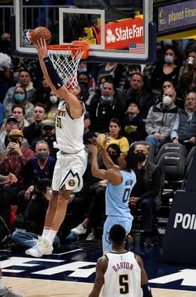 Denver Nuggets forward Aaron Gordon (L) goes in for a basket as Memphis Grizzlies guard De Anthony Melton (R, background) and Denver Nuggets forward Will Barton (R, foreground) look on during the third quarter of the NBA, Basketball Herren, USA match held between the Memphis Grizzlies at the Ball Arena in Denver, CO, USA, 21 January 2022. Memphis Grizzlies defeated the Denver Nuggets, 122-118. Memphis Grizzlies at Denver Nuggets !ACHTUNG: NUR REDAKTIONELLE NUTZUNG!  Copyright: xToddxPiersonx USA4632 20220122-2720f97f0f160fbb76bc18567e68695892841c86