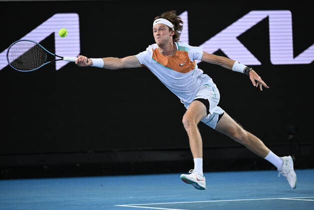 TENNIS AUSTRALIAN OPEN, Andrey Rublev of Russia plays a shot during his third round match against Marin Cilic of Croatia on Day 6 of the Australian Open, at Melbourne Park, in Melbourne, Saturday, January 22, 2022. ( NO ARCHIVING, EDITORIAL USE ONLY, NO USE IN BOOKS WITHOUT CONSENT MELBOURNE VIC AUSTRALIA  Copyright: xDEANxLEWINSx 20220122001615838813